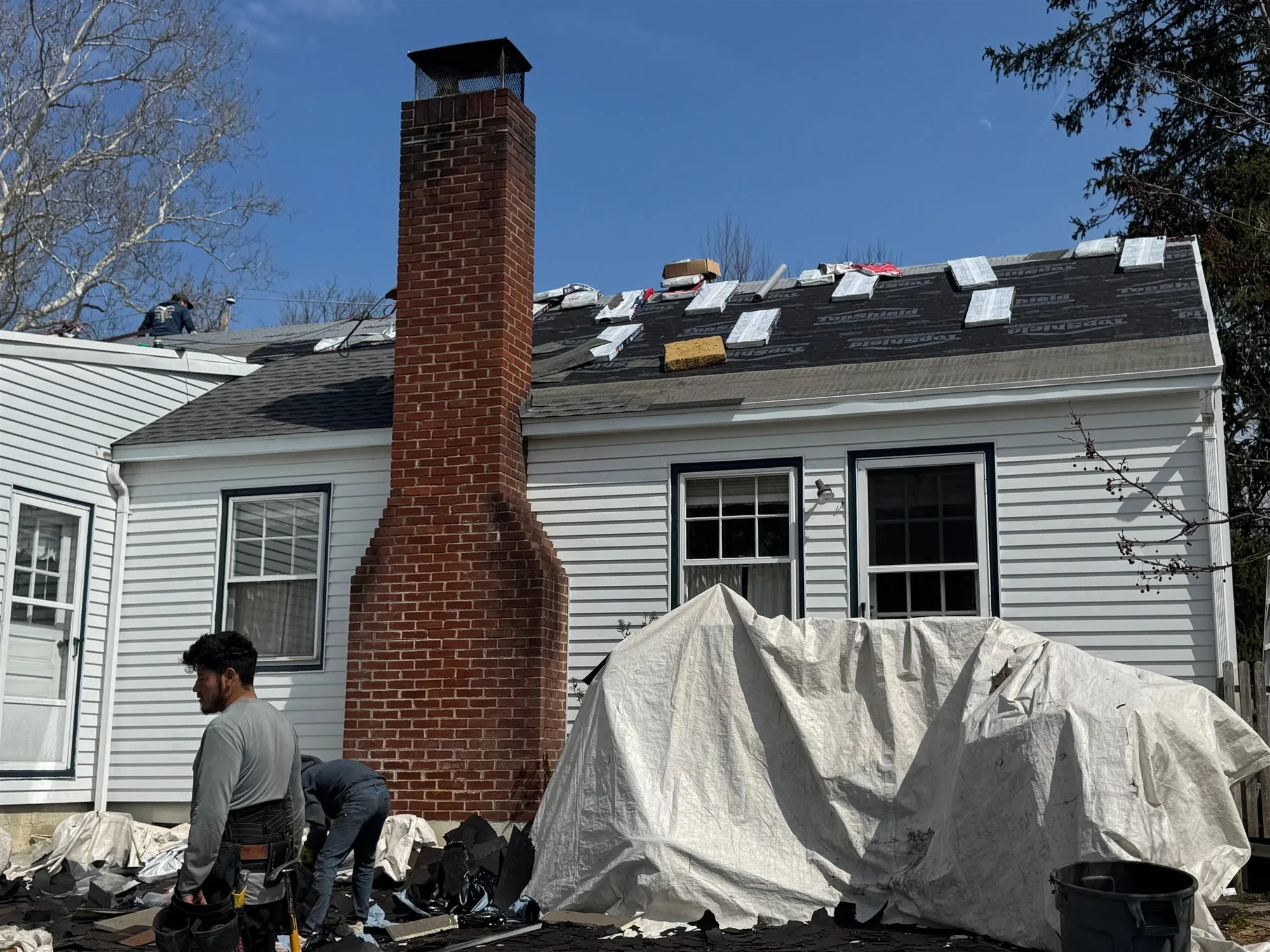 Brick chimney on a house during roof and chimney work